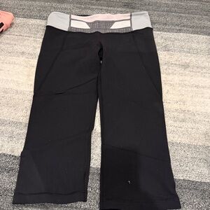 Black Lulu Lemon Kapris with Pink and Gray top and slitted bottoms